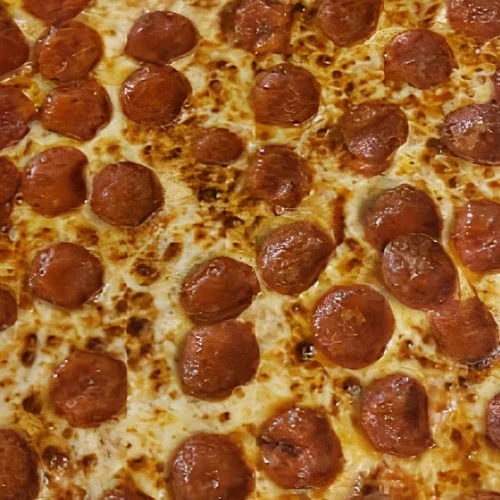 Pepperoni Pizza - Classic pepperoni pizza with a crispy crust and rich tomato sauce.