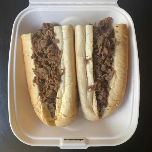 Steak Cheese Sub - Hearty sub packed with tender steak and melted cheese.